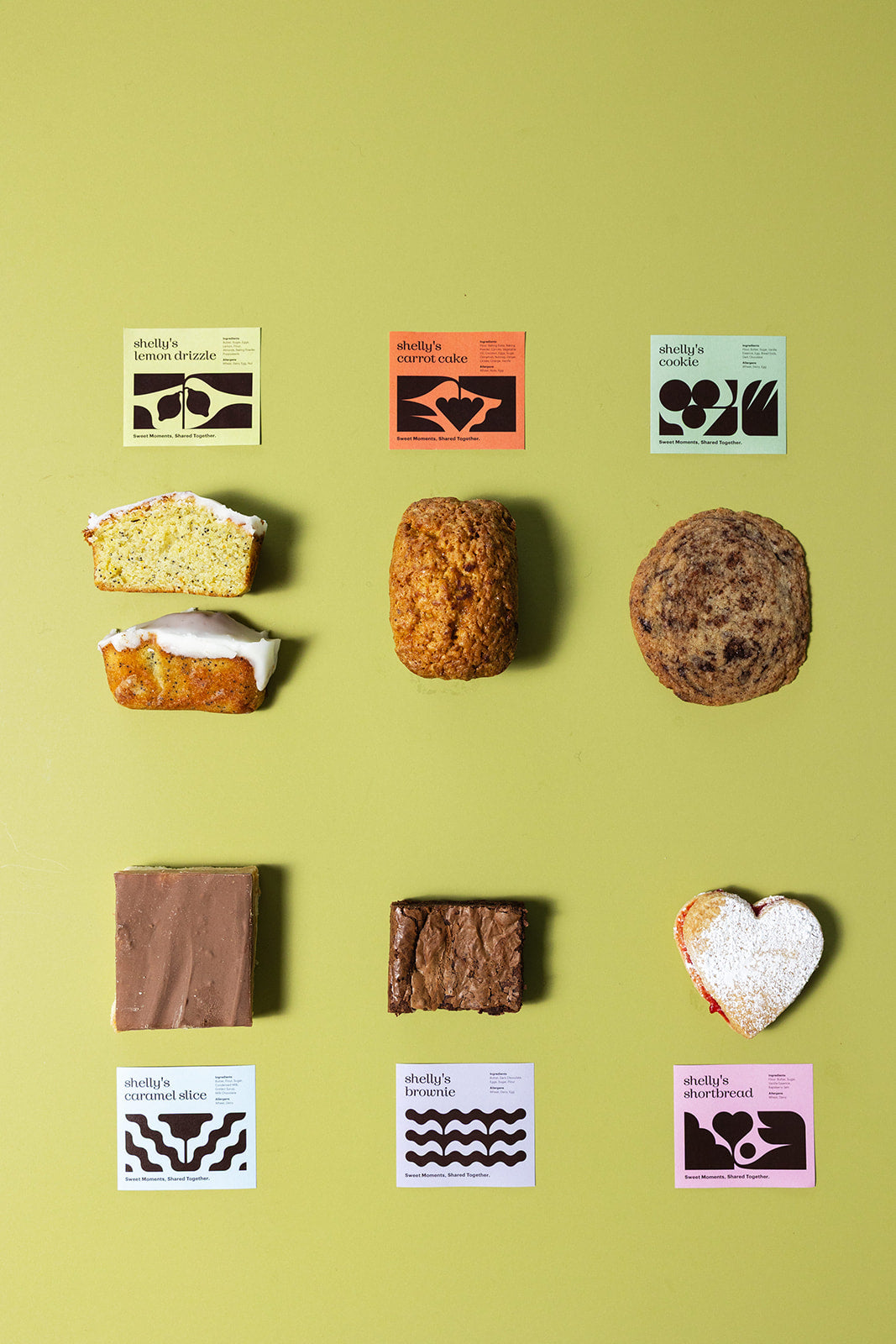 All six Shelly's treats, labelled, laid out on green